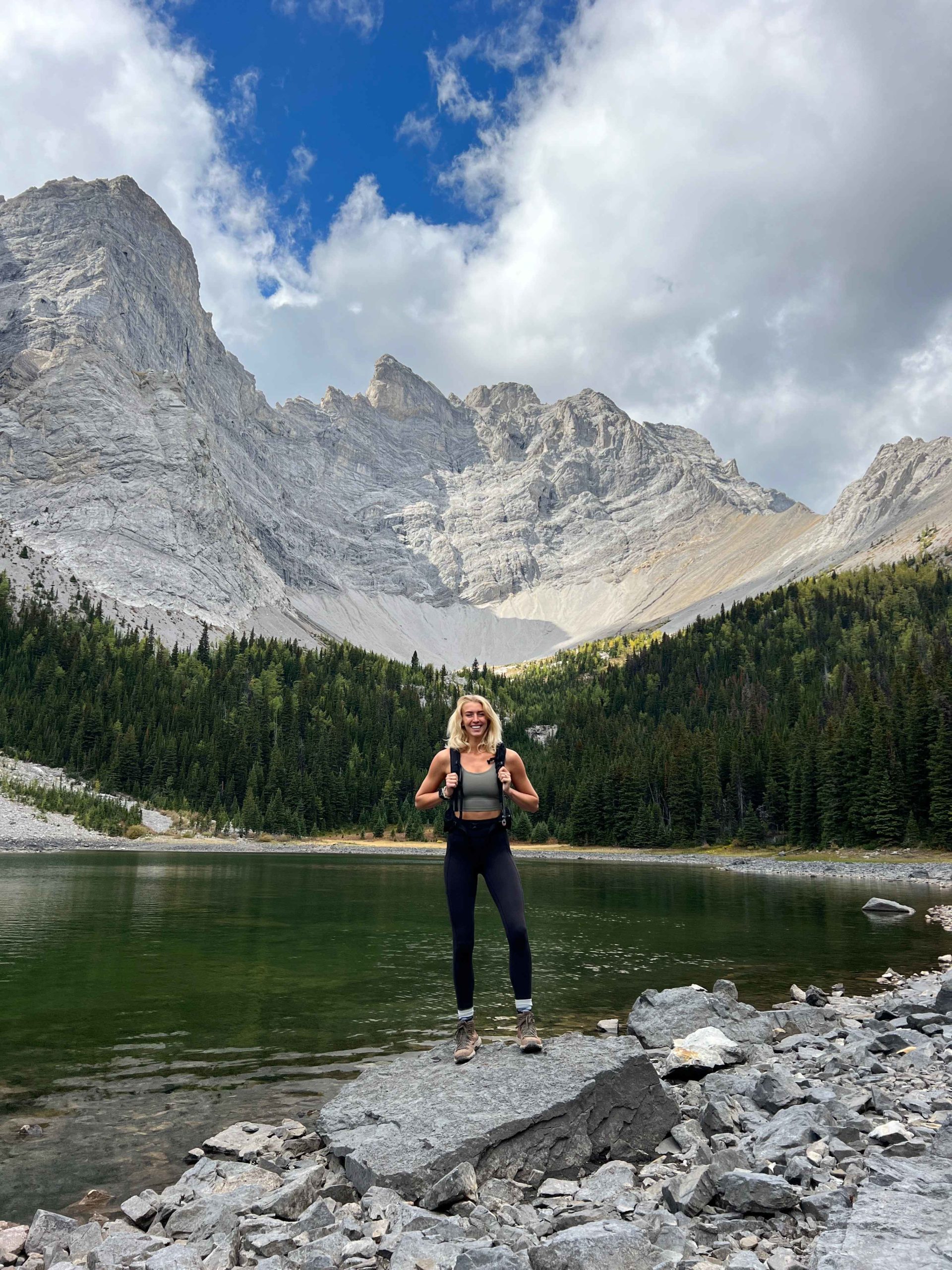 Zanna van Dijk stands in front of Tombstone Lakes in Kananaskis, Canada - Canada Road Trip Itinerary