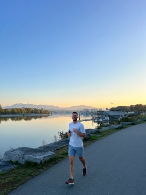 Running along the seawall in Vancouver at dusk