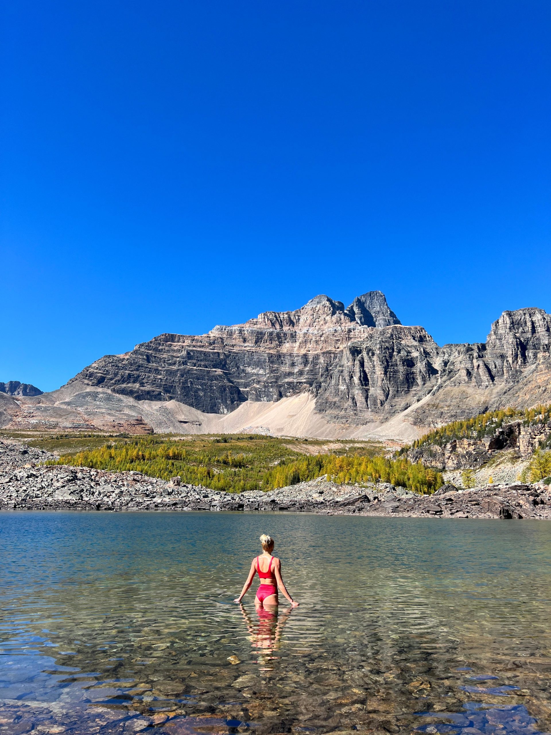 Zanna van Dijk stood in Eiffel Lake in the Rockies, Canada - Canada Road Trip Itinerary