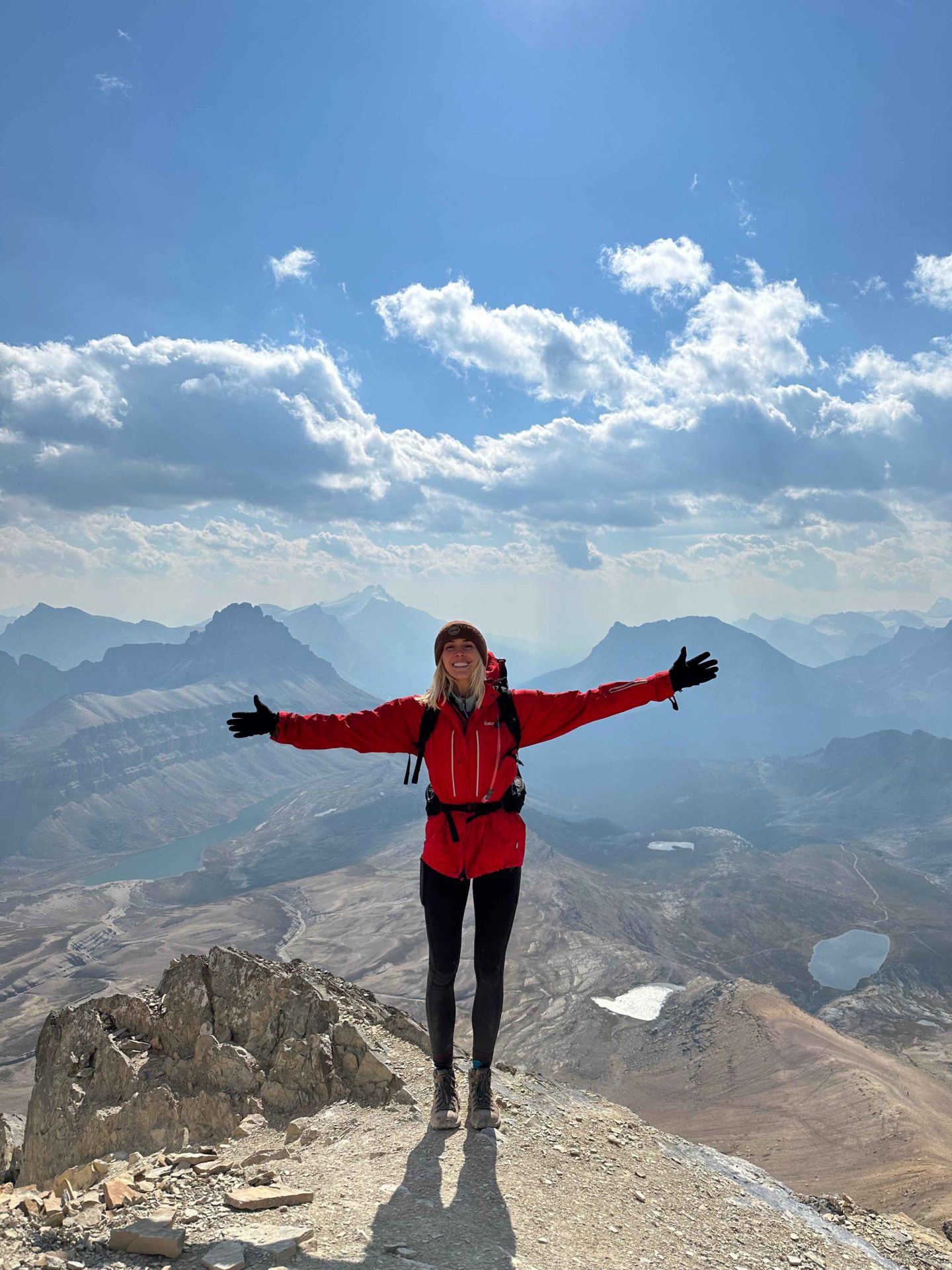 Zanna van Dijk stands at the top of Cirque Peak in the Rockies, Canada - Canada Road Trip Itinerary