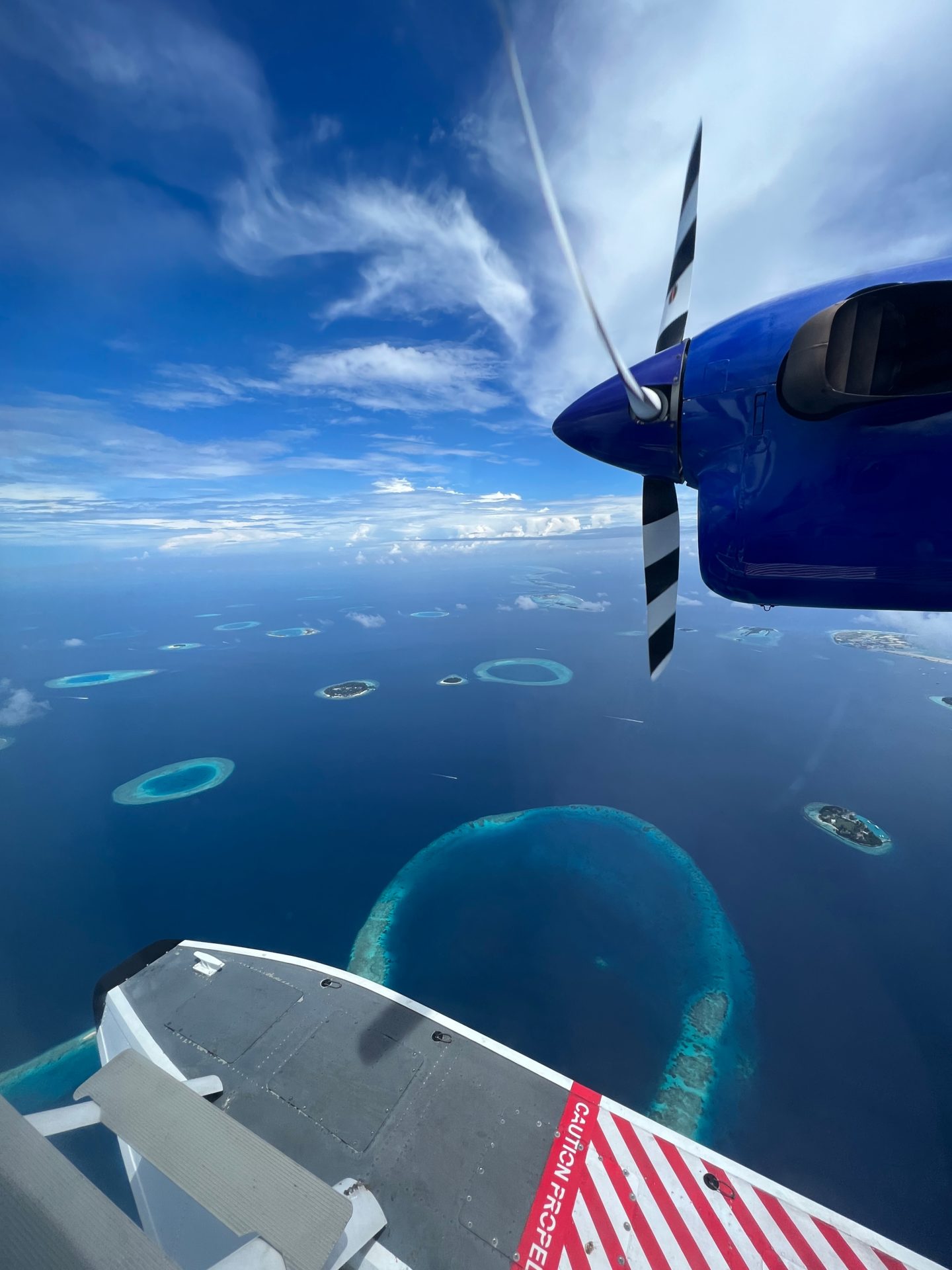 Views of the Maldives through the window of a sea plane