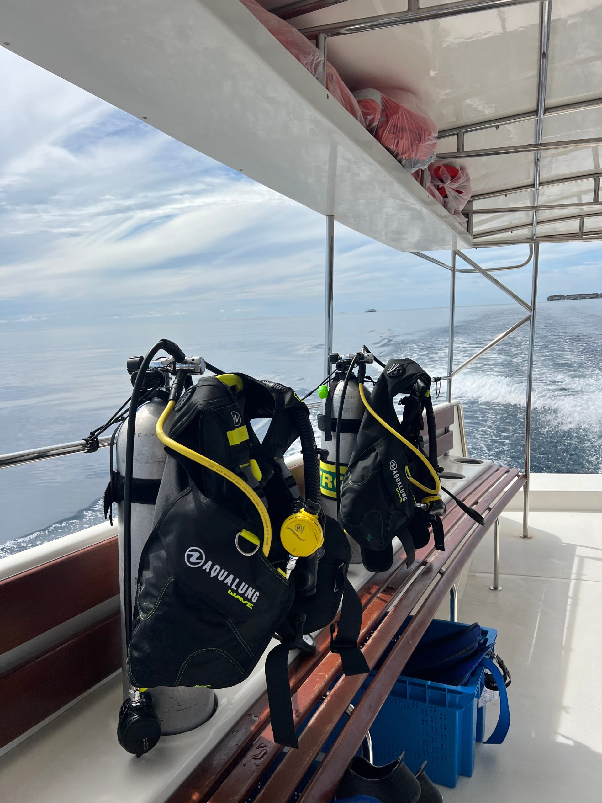 Scuba diving equipment on the side of a boat in the Maldives