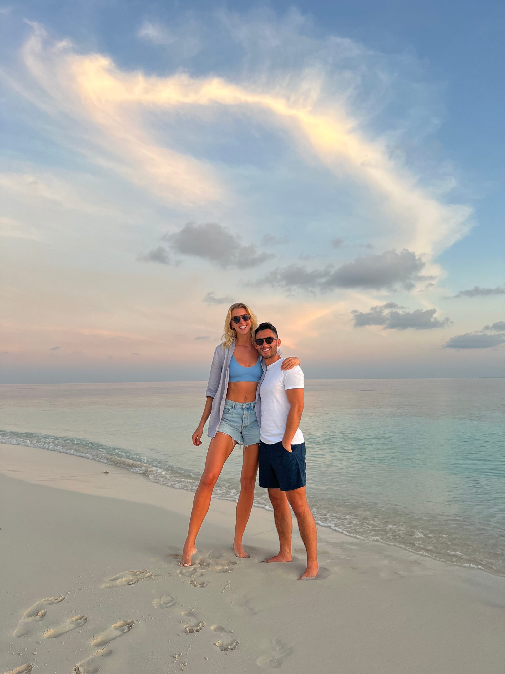 Zanna van Dijk and Ant stood on the beach in the Maldives