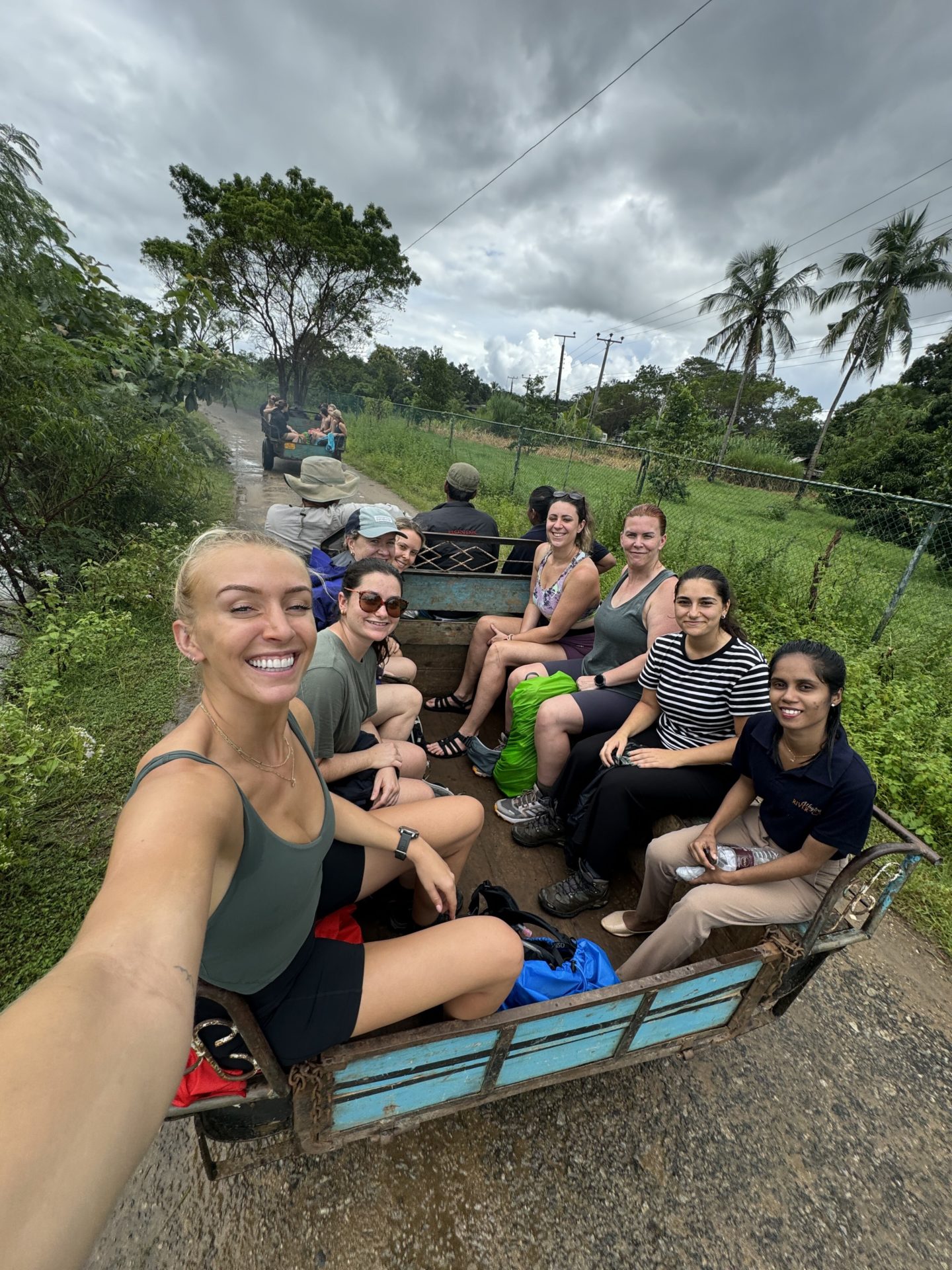 A group of women sit inside a trailer in the middle of Sri Lanka