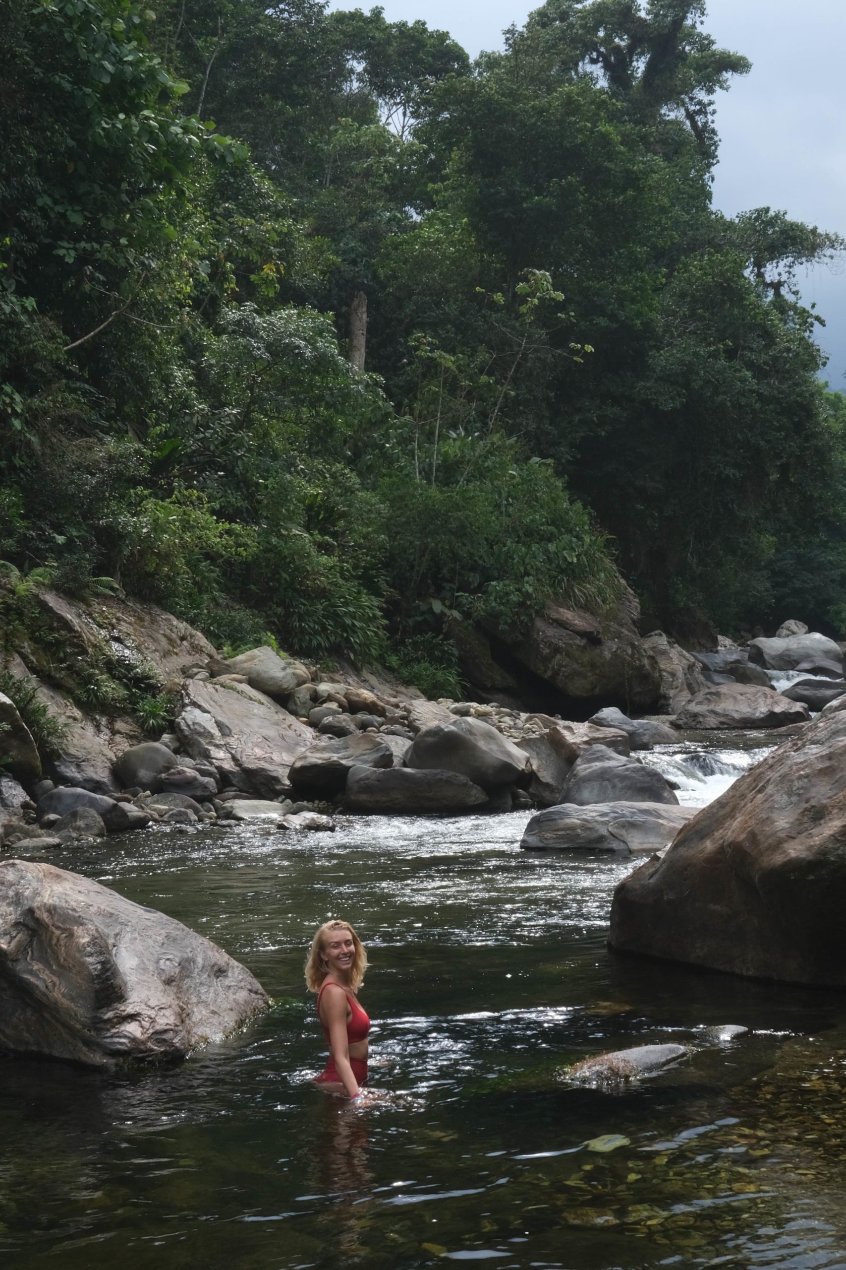 Zanna van Dijk in a river during the Lost City Trek in Colombia